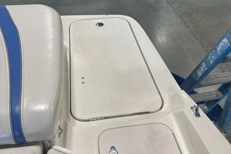 Slide: The Image of 2007 Bayliner 197 boat interior with white and blue seating. - 6