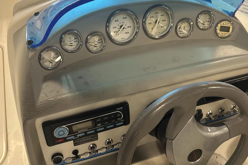 Slide: The Image of Dashboard of a 2007 Bayliner 197 boat with gauges and controls. - 8