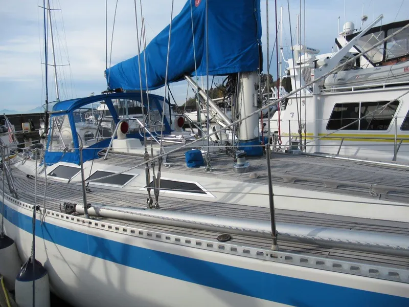 Slide: The Image of 1981 Sweden Yachts 41 sailboat with blue accents docked at a marina. - 10
