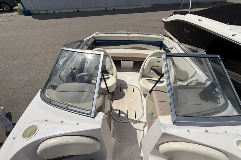Slide: The Image of 1997 Four Winns 170 Horizon Ski/Fish boat interior with seating and windshield. - 7
