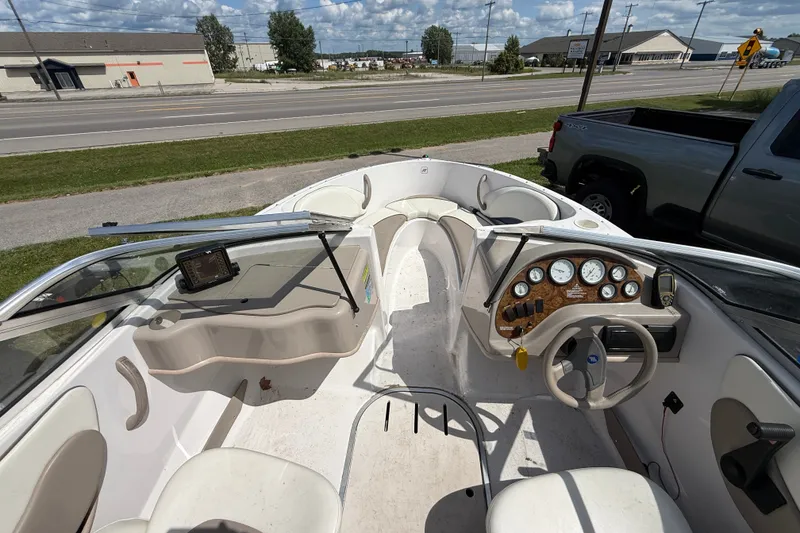 Slide: The Image of Interior of a 1997 Four Winns 170 Horizon Ski/Fish boat with dashboard and seating. - 6