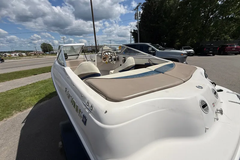 Slide: The Image of 1997 Four Winns 170 Horizon Ski/Fish boat parked outdoors on a sunny day. - 11