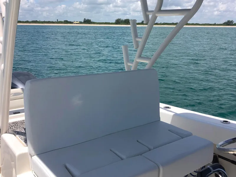 Slide: The Image of 2014 Cobia 296 Center Console boat with seating, ocean view in background. - 5