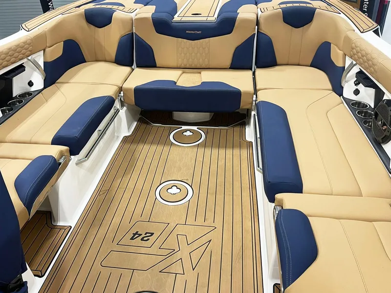 Slide: The Image of 2022 MasterCraft NXT24 boat cockpit with modern steering wheel and digital display. - 7