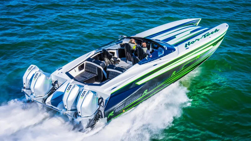 Slide: The Image of 2025 Nor-Tech 4000 Supercat speedboat cruising on vibrant blue water. - 11