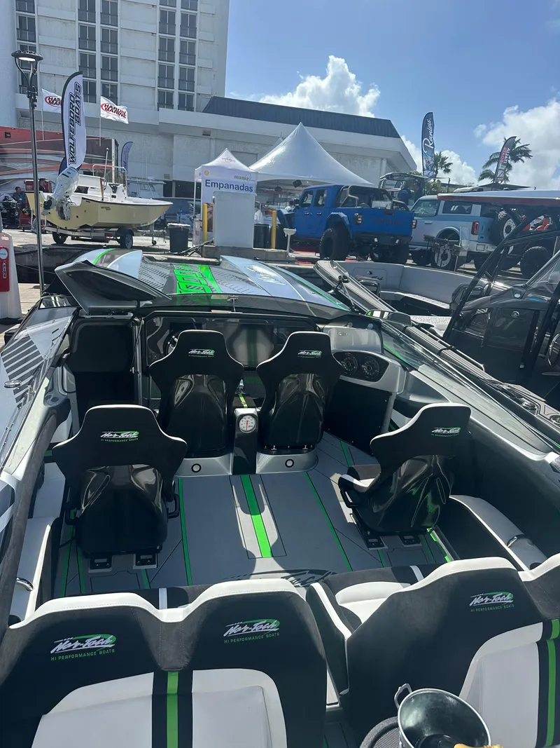 Slide: The Image of 2025 Nor-Tech 4000 Supercat boat interior at outdoor event, showcasing sleek design and seating. - 15