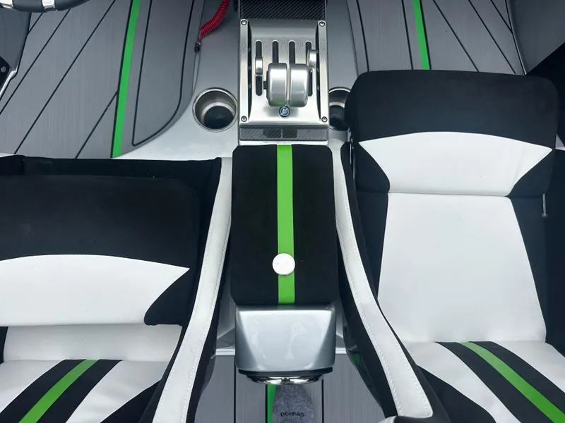 Slide: The Image of Interior of 2025 Nor-Tech 4000 Supercat with sleek black, white, and green seating. - 18