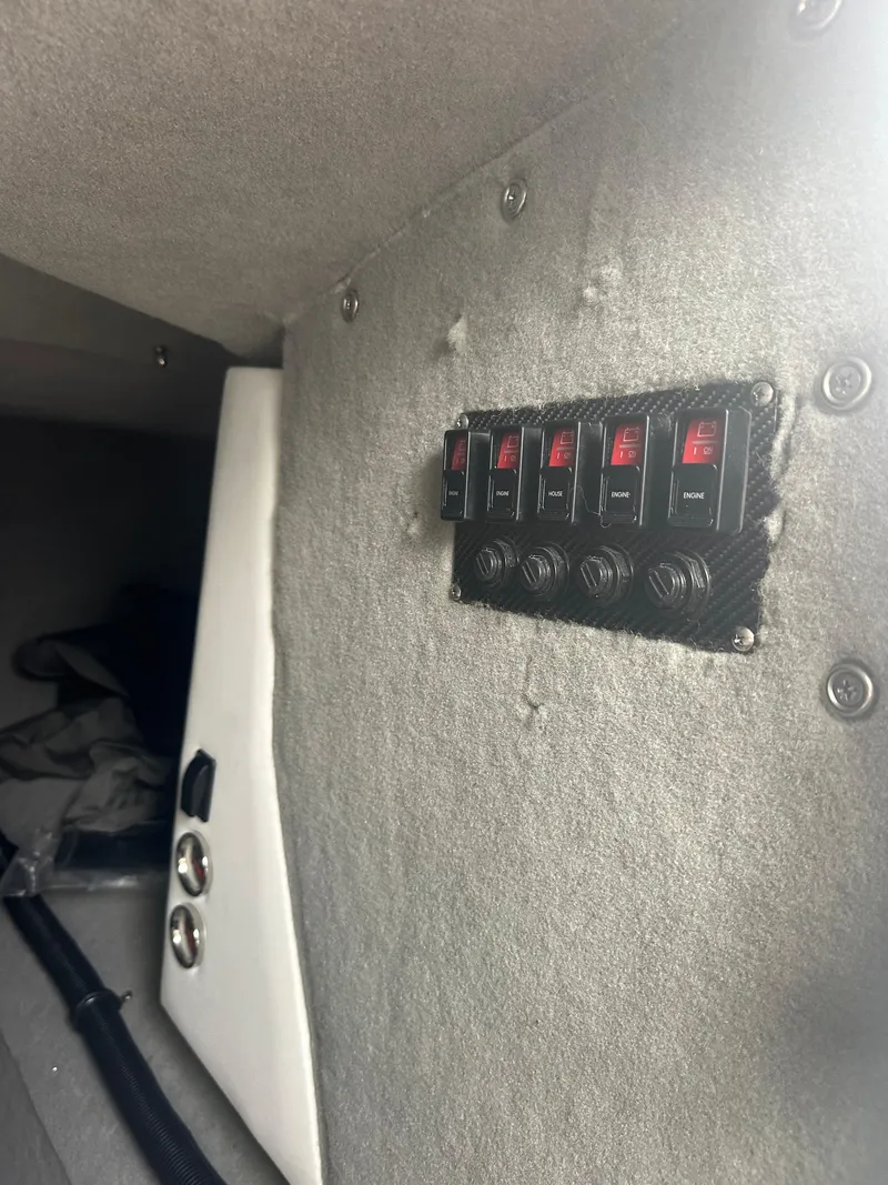 Slide: The Image of Interior view of 2025 Nor-Tech 4000 Supercat with control panel and switches. - 25