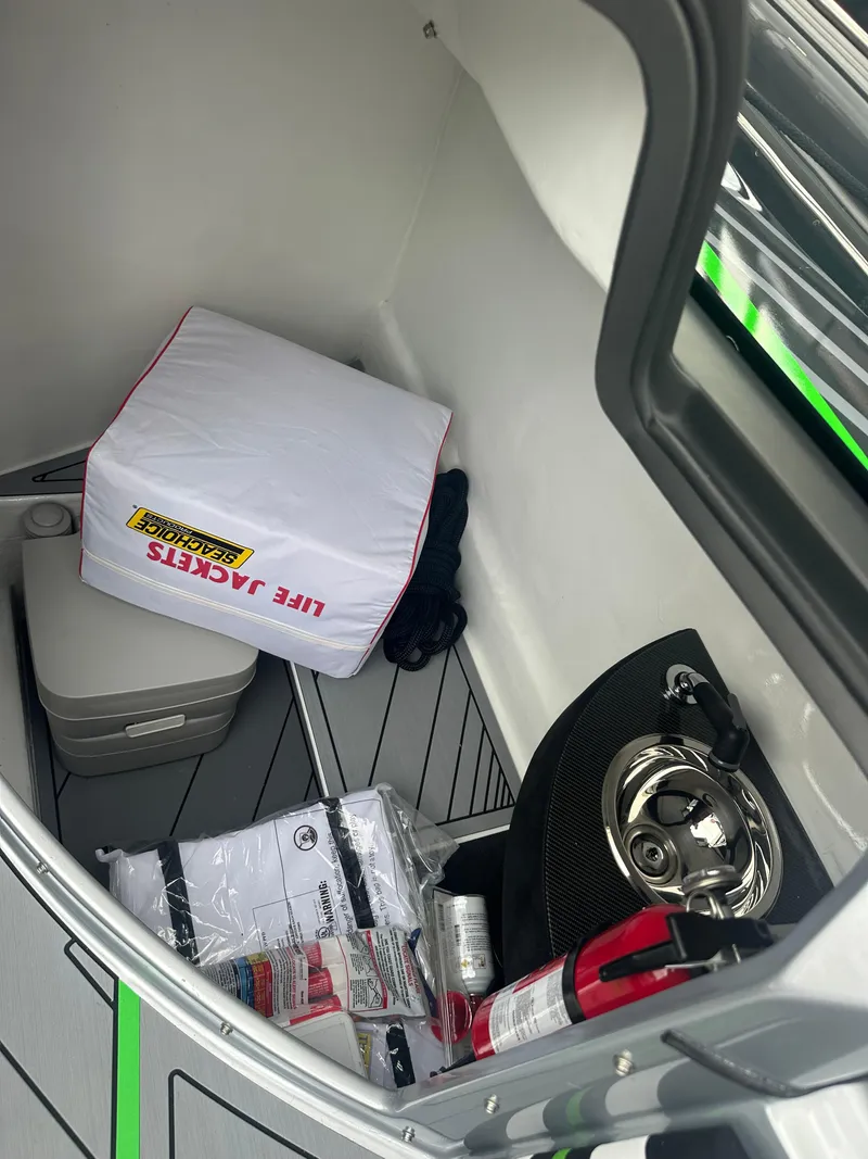 Slide: The Image of Interior of 2025 Nor-Tech 4000 Supercat with life jackets and safety equipment. - 26