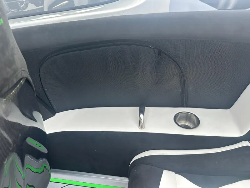 Slide: The Image of Interior of 2025 Nor-Tech 4000 Supercat boat, featuring sleek black and white seating. - 29