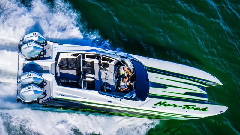 Slide: The Image of 2025 Nor-Tech 4000 Supercat speedboat cruising on open water. - 4
