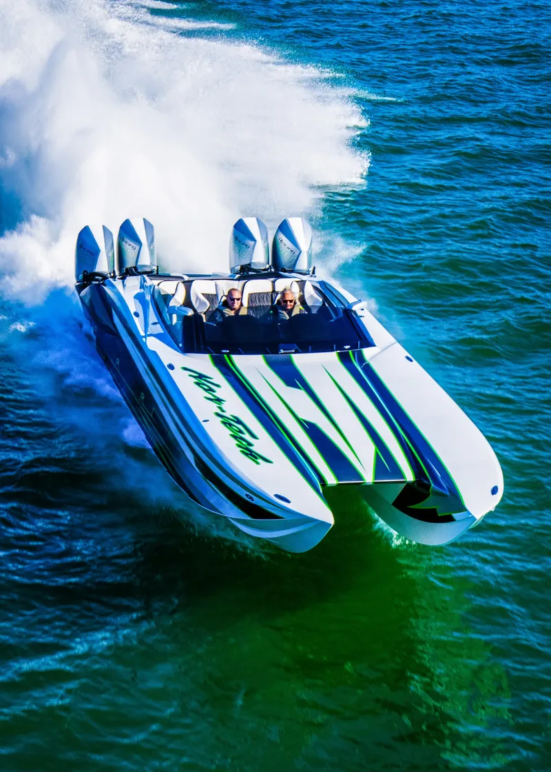 Slide: The Image of 2025 Nor-Tech 4000 Supercat speedboat racing on open water. - 5