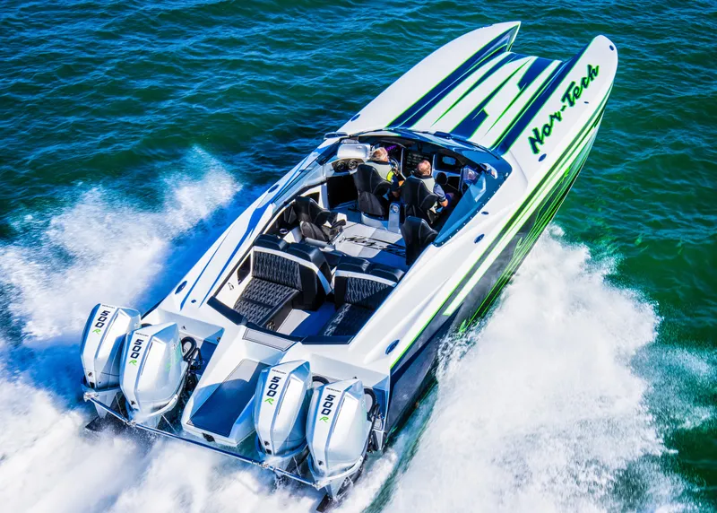 Slide: The Image of 2025 Nor-Tech 4000 Supercat speedboat cruising on water, featuring sleek design and powerful engines. - 7