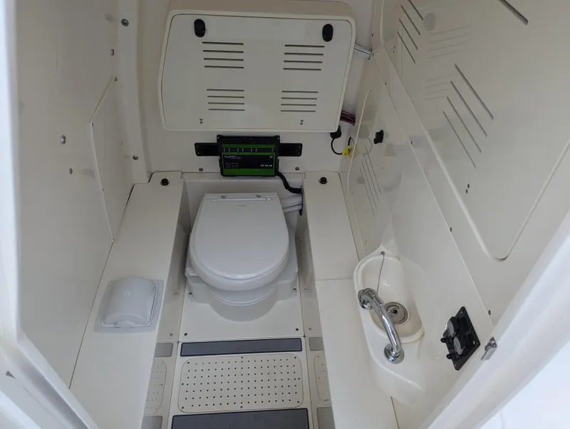 Slide: The Image of 2025 Blackwood 290LXF boat interior bathroom with toilet and sink. - 12