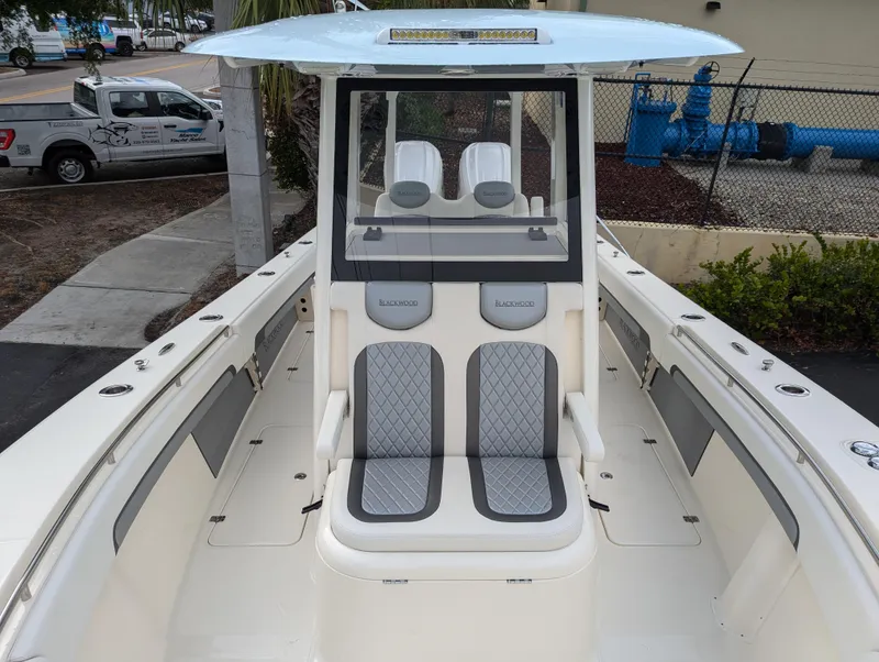 Slide: The Image of 2025 Blackwood 290LXF boat interior with dual seating and modern design. - 14