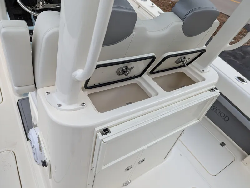Slide: The Image of 2025 Blackwood 290LXF boat interior with storage compartments and seating. - 17