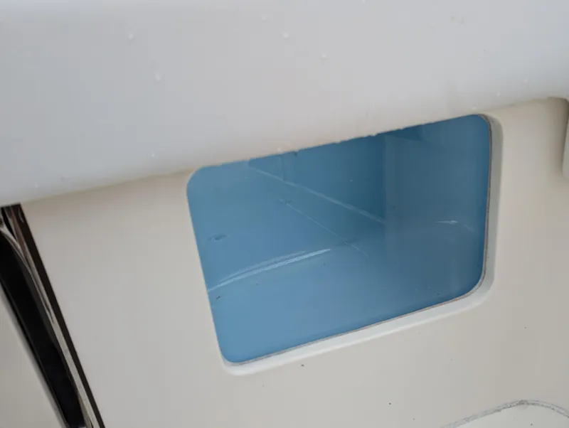 Slide: The Image of 2025 Blackwood 290LXF boat interior detail with blue compartment. - 24