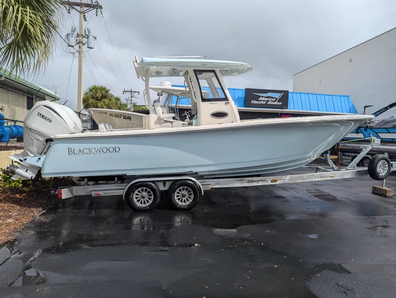 Slide: The Image of 2025 Blackwood 290LXF boat on trailer, parked outdoors. - 30