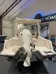 Slide: The Image of 2025 Grady-White Freedom 235 boat displayed indoors, rear view. - 3