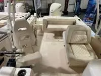 Slide: The Image of 2025 Grady-White Freedom 235 boat interior with seating and helm. - 5