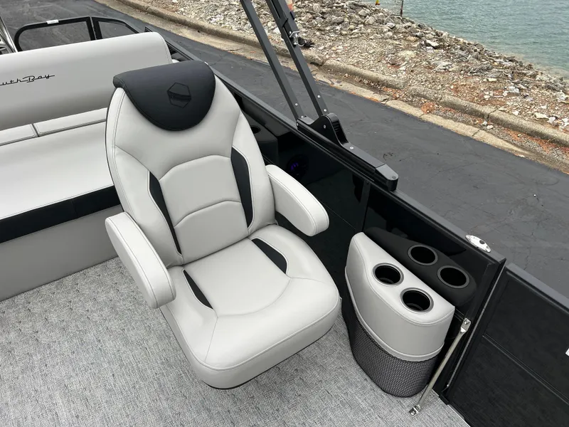 Slide: The Image of 2025 South Bay LE 222 UL boat interior with captain's chair and cup holders. - 10