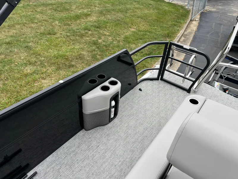 Slide: The Image of 2025 South Bay LE 222 UL pontoon boat with seating and cup holders on deck. - 13