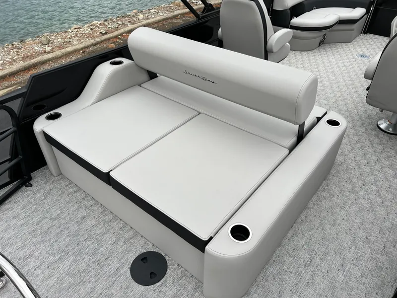 Slide: The Image of 2025 South Bay LE 222 UL boat interior with plush seating and cup holders. - 16