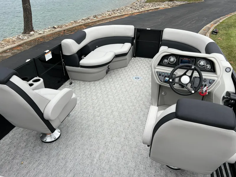 Slide: The Image of 2025 South Bay LE 222 UL pontoon boat interior with modern seating and steering console. - 18