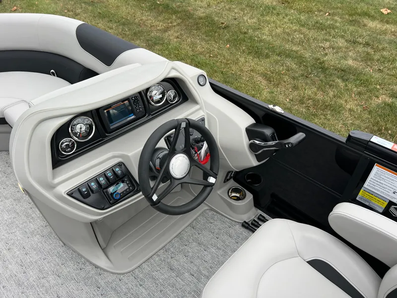 Slide: The Image of 2025 South Bay LE 222 UL boat interior with modern dashboard and steering wheel. - 19
