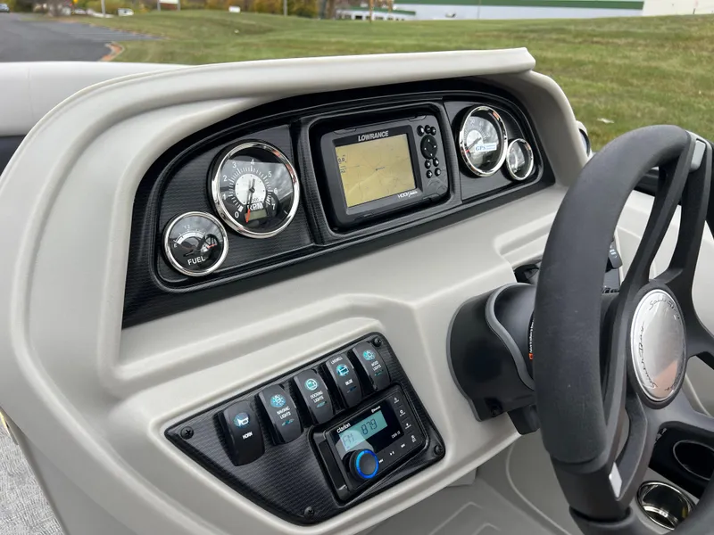 Slide: The Image of 2025 South Bay LE 222 UL boat dashboard with steering wheel and control panel. - 20