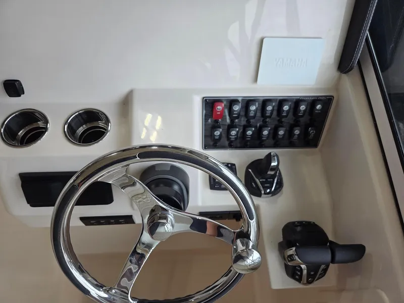 Slide: The Image of Steering console of 2025 Grady-White Freedom 285 boat with Yamaha controls. - 11