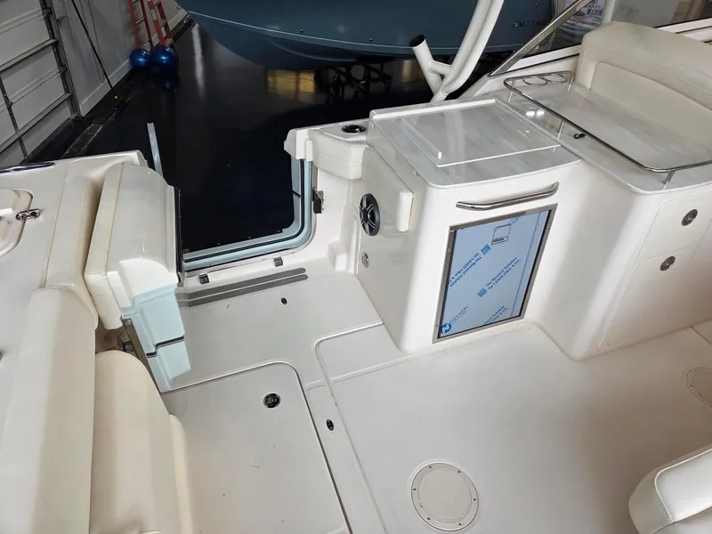 Slide: The Image of 2025 Grady-White Freedom 285 boat interior with seating and storage compartments. - 7