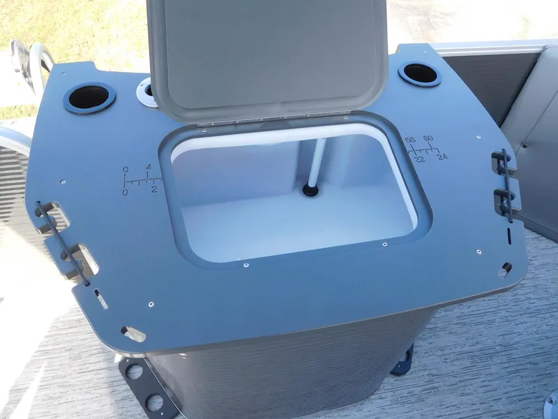Slide: The Image of Bennington 23 SS 2025 boat cooler with open lid and cup holders. - 11