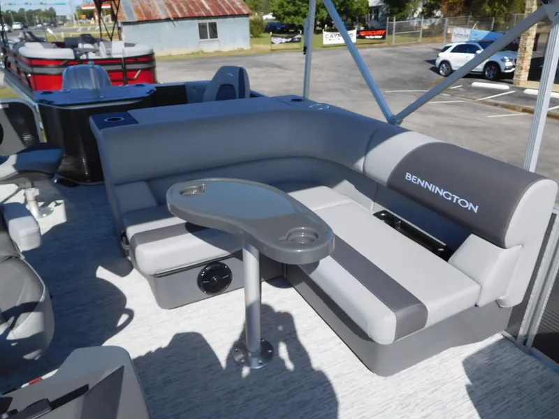 Slide: The Image of 2025 Bennington 23 SS pontoon boat with gray seating and table. - 4
