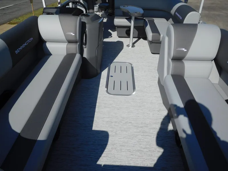 Slide: The Image of 2025 Bennington 23 SS pontoon boat interior with gray seating and flooring. - 5