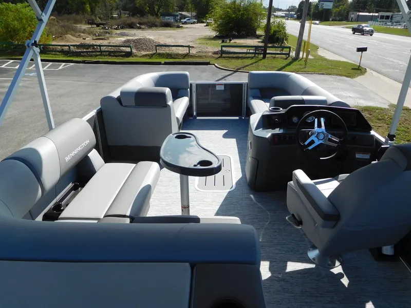 Slide: The Image of 2025 Bennington 23 SS pontoon boat interior with seating and steering console. - 6