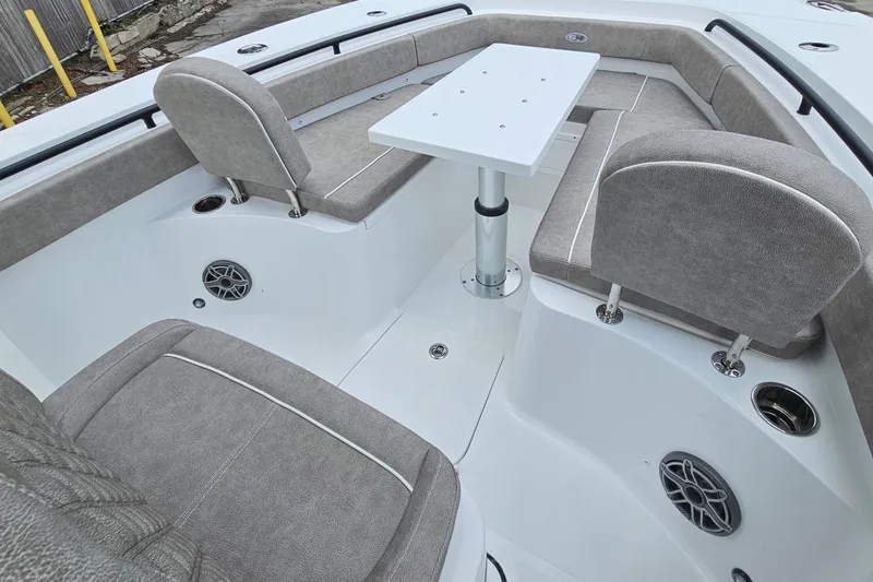 Slide: The Image of Interior of 2026 Sea Hunt Gamefish 25 boat with seating and table setup. - 20