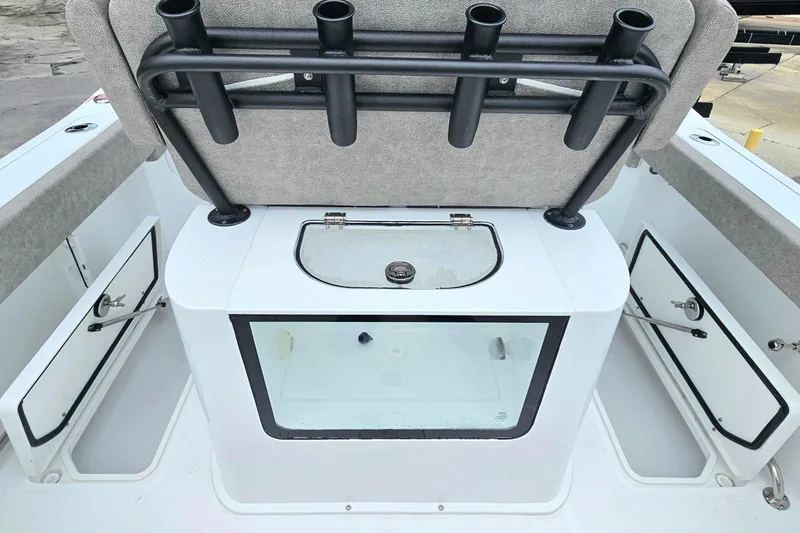 Slide: The Image of 2026 Sea Hunt Gamefish 25 boat interior with rod holders and storage compartments. - 9