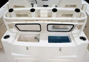 Slide: The Image of 2025 Grady-White Canyon 306 boat interior with rod holders and storage compartments. - 8