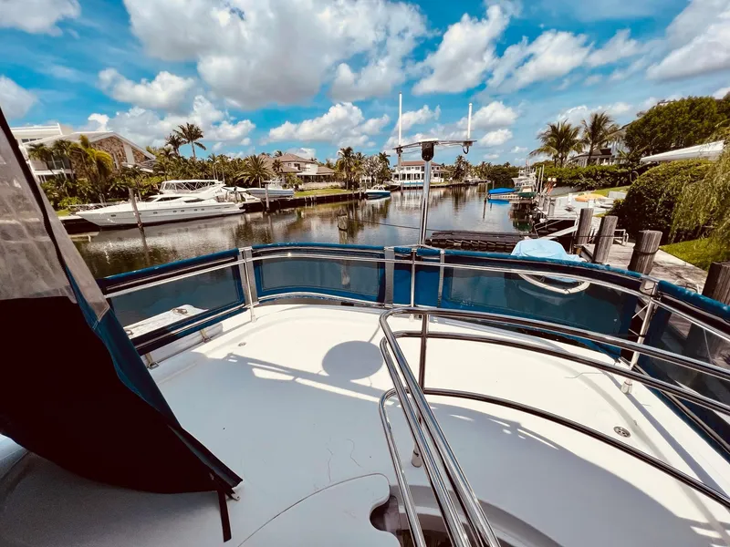 Slide: The Image of Fountaine Pajot Cumberland 47 LC yacht docked in a scenic marina, 2015 model. - 22