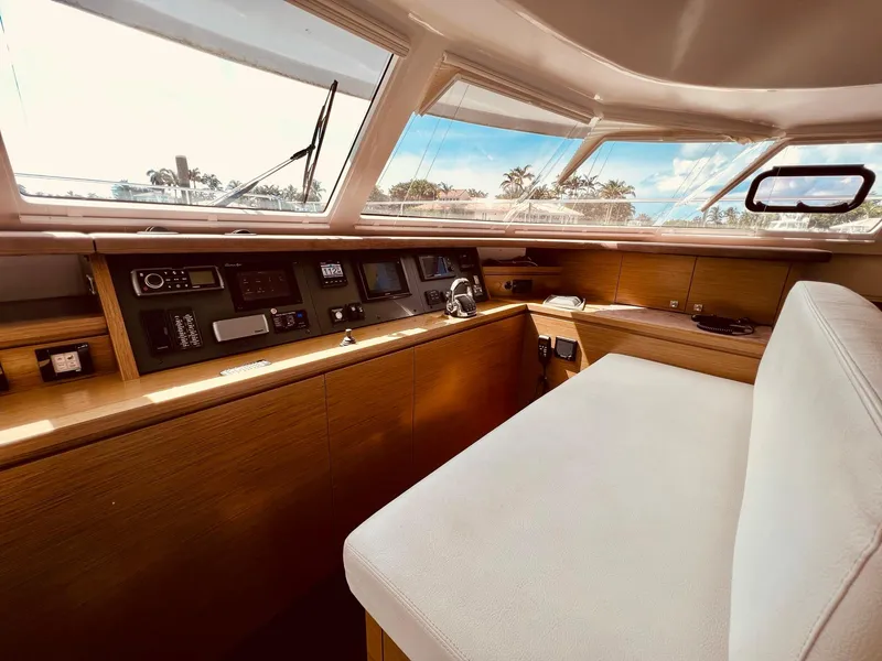 Slide: The Image of Interior helm of 2015 Fountaine Pajot Cumberland 47 LC yacht, featuring modern navigation equipment. - 34