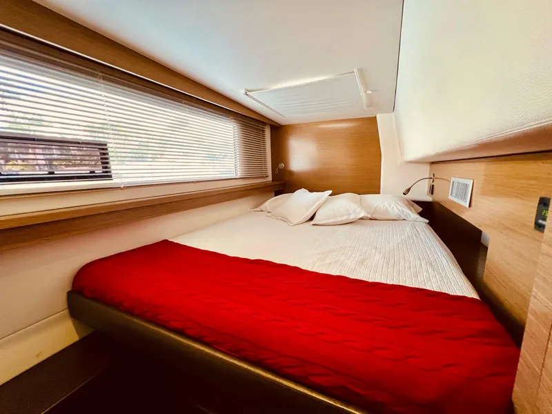 Slide: The Image of Cozy bedroom in 2015 Fountaine Pajot Cumberland 47 LC yacht with red bedding. - 38