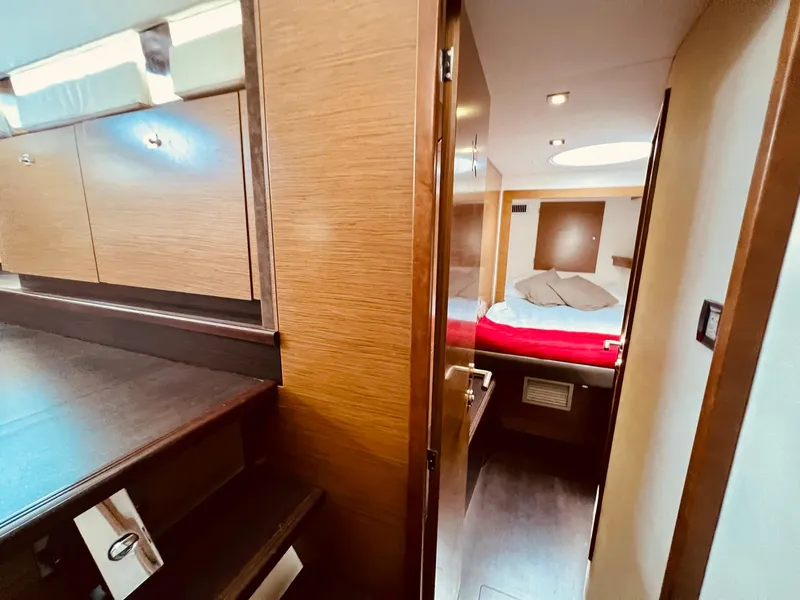 Slide: The Image of Interior of 2015 Fountaine Pajot Cumberland 47 LC yacht, featuring a cozy bedroom. - 40