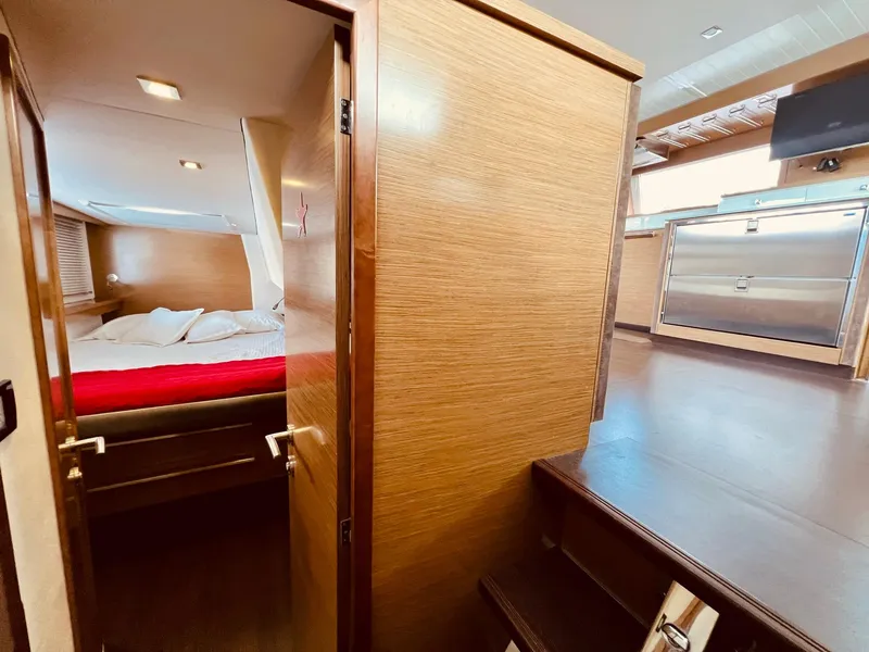 Slide: The Image of Interior of 2015 Fountaine Pajot Cumberland 47 LC, featuring cozy cabin and modern kitchen. - 41