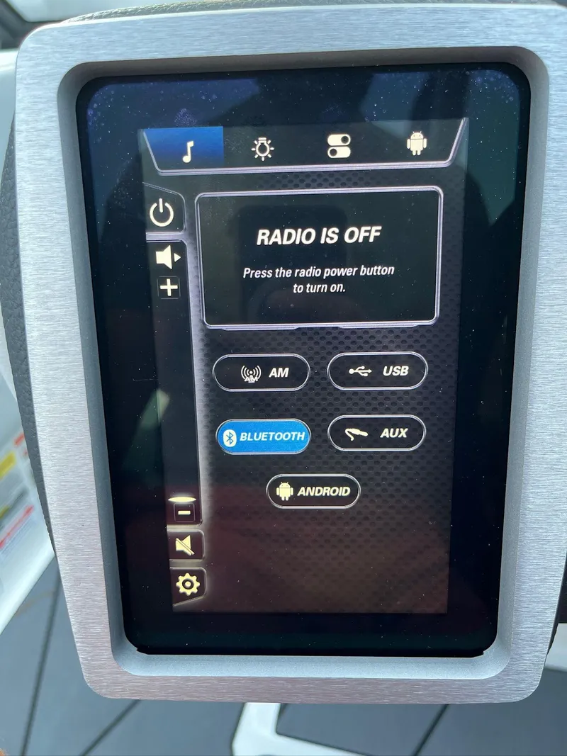 Slide: The Image of 2024 Malibu 20VTX touchscreen display showing radio and connectivity options. - 17