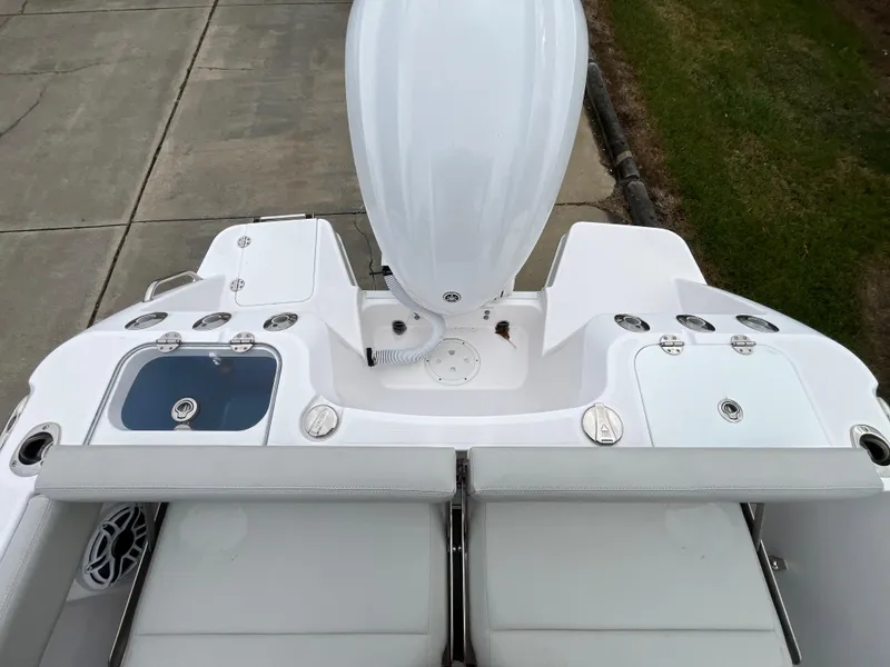 Slide: The Image of 2022 Everglades 235 Center Console boat, rear view with seating and engine. - 10