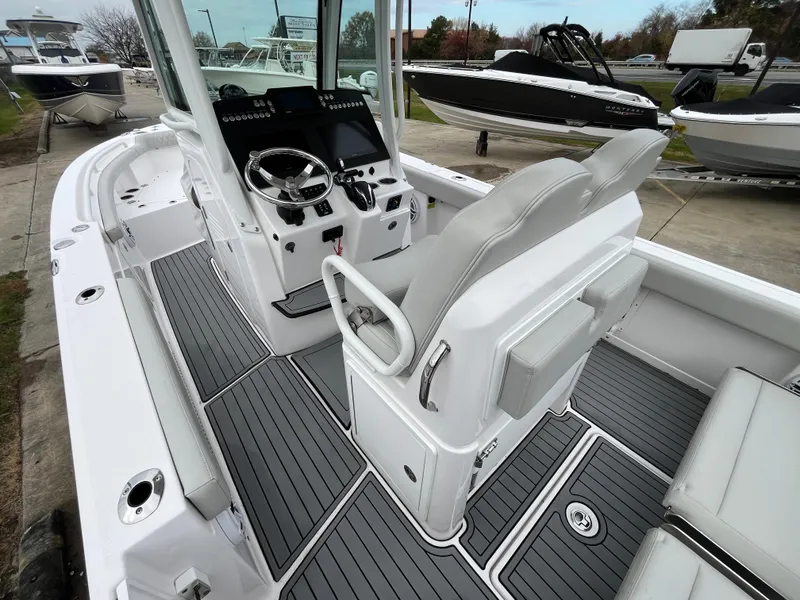 Slide: The Image of 2022 Everglades 235 Center Console boat interior with modern helm and seating. - 11