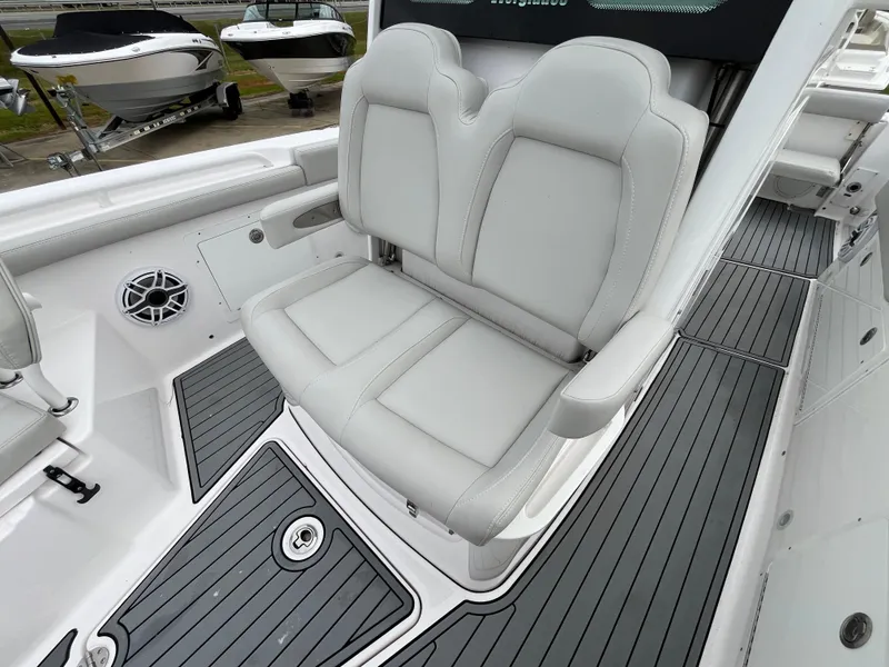Slide: The Image of 2022 Everglades 235 Center Console boat with gray seating and deck. - 23