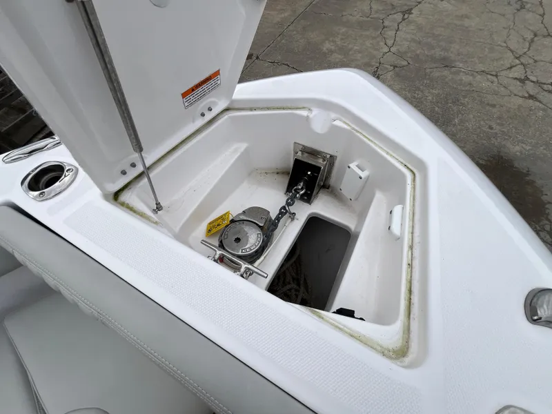 Slide: The Image of Open anchor compartment on 2022 Everglades 235 Center Console boat. - 28