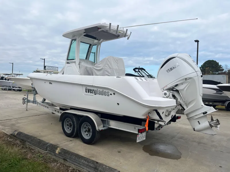 Slide: The Image of 2022 Everglades 235 Center Console boat on trailer with Yamaha outboard motor. - 4